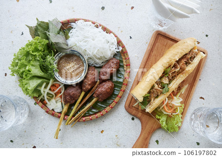 Traditional vietnamese food on table in restaurant. Traditional vietnamese food on table in restaurant. 106197802