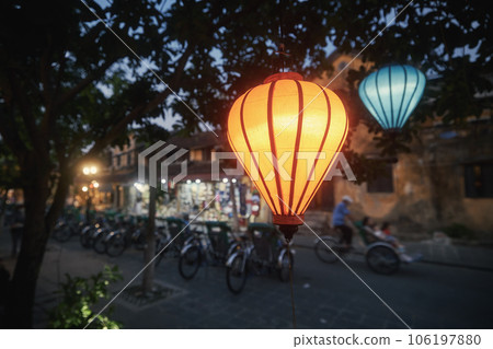 Traditional lanterns hanging on street in Vietnam. 106197880
