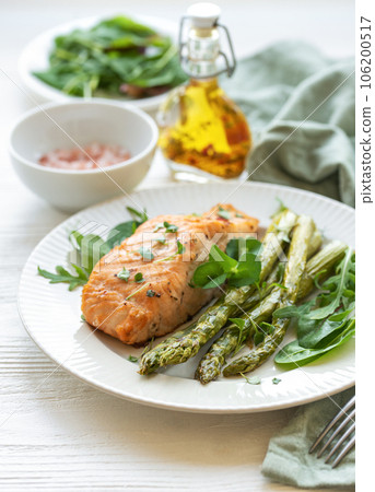 Baked Delicious salmon, green asparagus on plate Baked Delicious salmon, green asparagus on plate 106200517