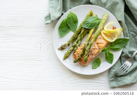 Baked Delicious salmon, green asparagus on plate Baked Delicious salmon, green asparagus on plate 106200518