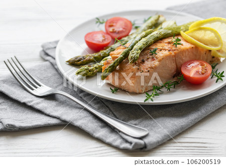 Baked Delicious salmon, green asparagus on  plate 106200519