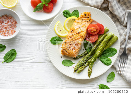 Baked Delicious salmon, green asparagus on plate Baked Delicious salmon, green asparagus on plate 106200520