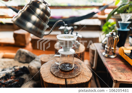 Closeup of hand make drip coffee in home Closeup of hand make drip coffee in home 106205481