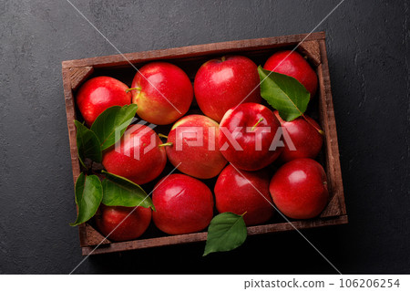 Wooden box with fresh red apples 106206254