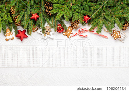 Christmas fir tree branch with decor and space Christmas fir tree branch with decor and space 106206284
