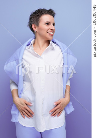 portrait of energetic cheerful young millennial woman with short haircut smiling 106206449