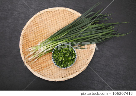 small green onions in a colander small green onions in a colander 106207413