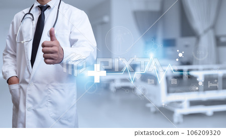Doctor in lab coat is showing thumb up on background in hospital interior. Medical concept. Medical information search concept. The concept of treating disease. insurance concept 106209320