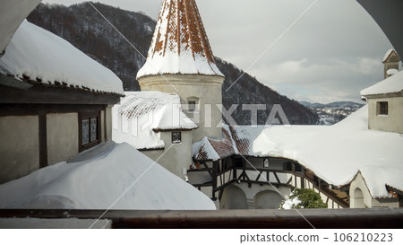 View from the windows on high towers and roof tops at ancient castle covered with snow View from the windows on high towers and roof tops at ancient castle covered with snow 106210223
