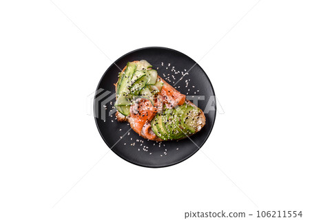 Fresh tasty sandwich with salmon, avocado and sesame and flax seeds Fresh tasty sandwich with salmon, avocado and sesame and flax seeds 106211554