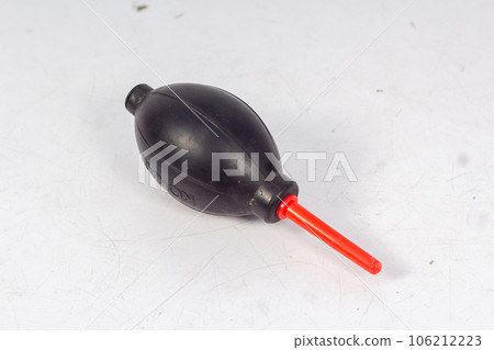 A Manual Hand Air Blower isolated on White Background, This blower is generally used to clean dust from the DSLR or Mirrorless cameras and, Lenses. 106212223