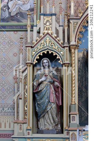 Immaculate heart of Mary statue on the Sacred heart of Jesus altar in the church of Saint Matthew in Stitar, Croatia. 106212241