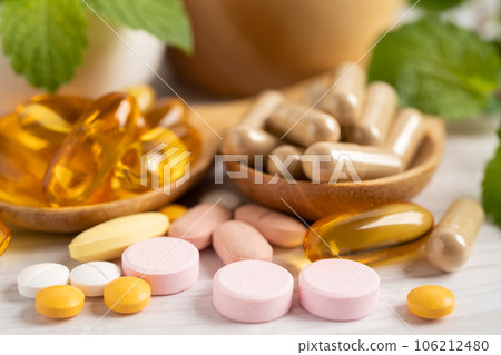 Alternative medicine herbal organic capsule with vitamin E omega 3 fish oil, mineral, drug with herbs leaf natural supplements for healthy good life. 106212480