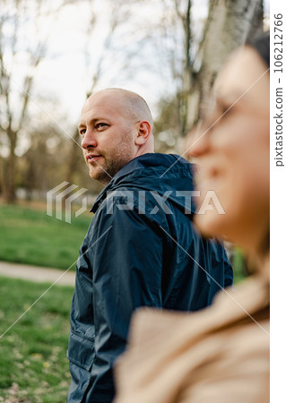 Happy couple on a walk in the park on autumn day close up 106212766