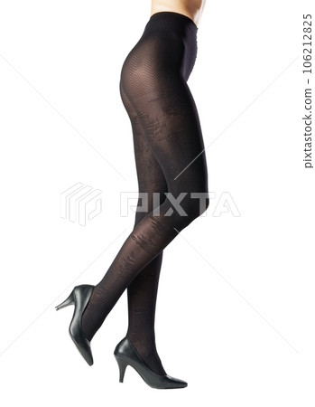Legs of a woman in black capron tights on white background Legs of a woman in black capron tights on white background 106212825