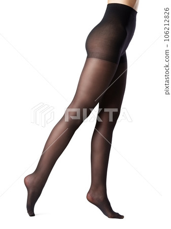 Legs of a woman in black capron tights on white background 106212826