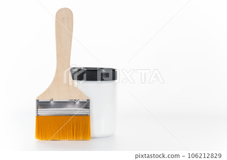 Brush and white dye placed on a white background 106212829