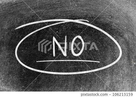 White chalk hand writing in word no and circle shape on blackboard background White chalk hand writing in word no and circle shape on blackboard background 106213159