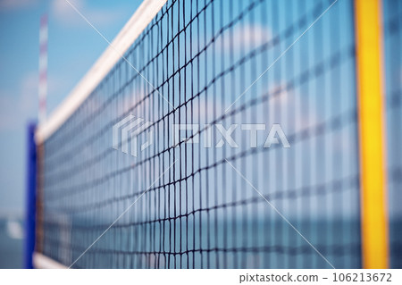 Volleyball net on the beach close-up against the blue sky Volleyball net on the beach close-up against the blue sky 106213672