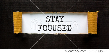 Stay focused symbol. Concept words Stay focused on beautiful white paper on a beautiful black background. Business, support, motivation, psychological stay focused concept. Copy space 106214868