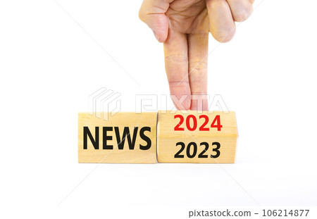 2024 News new year symbol. Businessman turns a wooden cube and changes words News 2023 to News 2024. Beautiful white table white background, copy space. Business 2024 news new year concept. 2024 News new year symbol. Businessman turns a wooden cube and changes words News 2023 to News 2024. Beautiful white table white background, copy space. Business 2024 news new year concept. 106214877