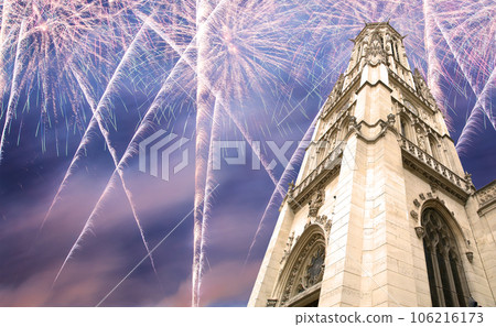 Celebratory fireworks over the Great gothic church of Saint Germain l Auxerrois, Paris, France 106216173
