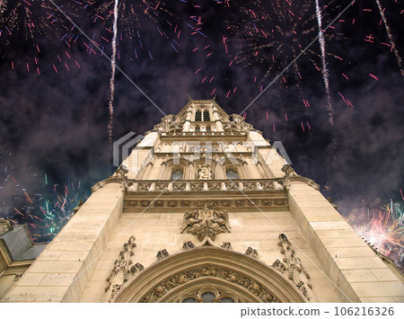 Celebratory fireworks over the Great gothic church of Saint Germain l Auxerrois, Paris, France 106216326