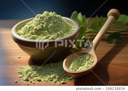 Spoon with green matcha tea powder on wooden utensil Spoon with green matcha tea powder on wooden utensil 106216834