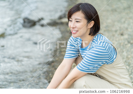 Woman refreshing at the lake Woman traveling Woman traveling Woman going on holiday Woman refreshing at the lake Woman traveling Woman traveling Woman going on holiday 106216998