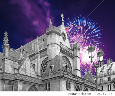 Celebratory fireworks over the Great gothic church of Saint Germain l Auxerrois, Paris, France 106217047