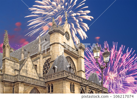 Celebratory fireworks over the Great gothic church of Saint Germain l Auxerrois, Paris, France 106217074