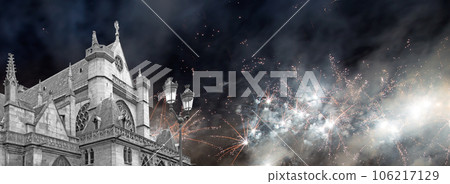Celebratory fireworks over the Great gothic church of Saint Germain l Auxerrois, Paris, France 106217129