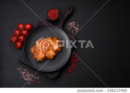 Delicious fresh sea fish cut into pieces and baked in tomato sauce Delicious fresh sea fish cut into pieces and baked in tomato sauce 106217400