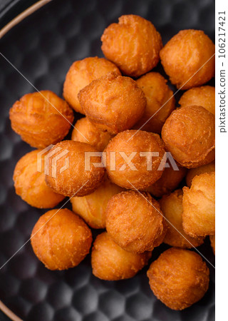 Delicious fried potato balls with breaded mozzarella, salt, spices and herbs Delicious fried potato balls with breaded mozzarella, salt, spices and herbs 106217421