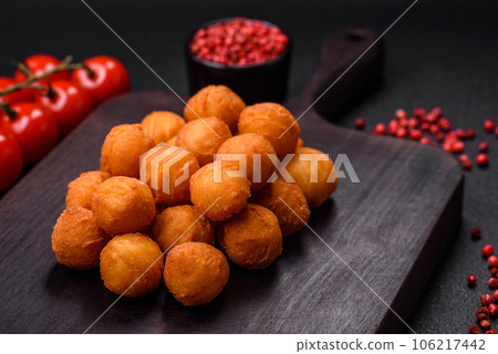 Delicious fried potato balls with breaded mozzarella, salt, spices and herbs Delicious fried potato balls with breaded mozzarella, salt, spices and herbs 106217442