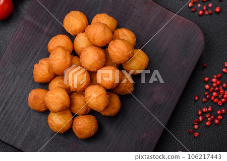 Delicious fried potato balls with breaded mozzarella, salt, spices and herbs Delicious fried potato balls with breaded mozzarella, salt, spices and herbs 106217443