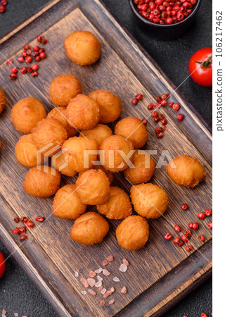 Delicious fried potato balls with breaded mozzarella, salt, spices and herbs Delicious fried potato balls with breaded mozzarella, salt, spices and herbs 106217462