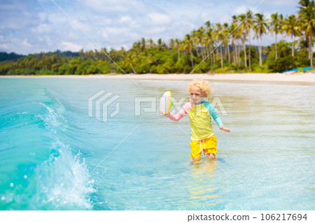 Child on tropical beach. Sea vacation with kids. Child on tropical beach. Sea vacation with kids. 106217694