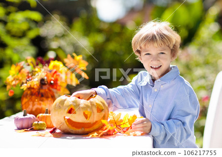 Family carving pumpkin for Halloween Family carving pumpkin for Halloween 106217755