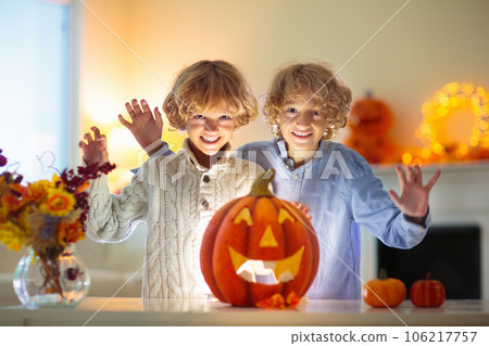 Family carving pumpkin for Halloween Family carving pumpkin for Halloween 106217757