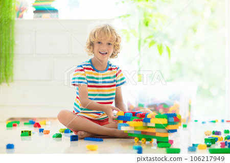 Child playing with toy blocks. Toys for kids. Child playing with toy blocks. Toys for kids. 106217949