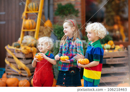 Kids having fun at pumpkin patch Kids having fun at pumpkin patch 106218463