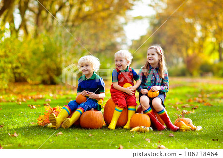 Kids having fun at pumpkin patch 106218464