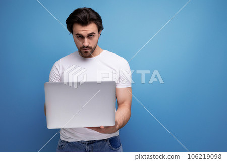 successful freelancer man with laptop in studio successful freelancer man with laptop in studio 106219098