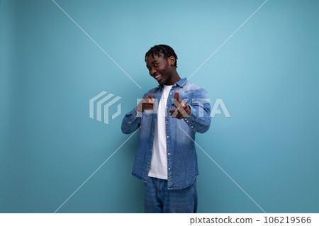 confident african young man with dreadlocks in casual denim jacket 106219566