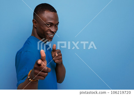 young attractive african man dressed in t-shirt on studio background with copy space young attractive african man dressed in t-shirt on studio background with copy space 106219720