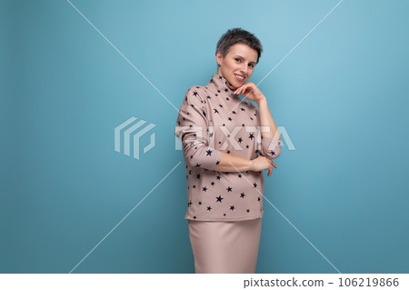 pretty well-groomed young career woman with gray streaked hair is dressed in a skirt and blouse 106219866