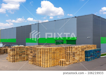 Wooden pallets heap in the cargo warehouse Wooden pallets heap in the cargo warehouse 106219933
