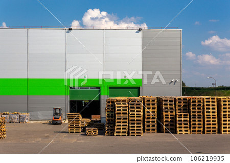 Wooden pallets heap in the cargo warehouse Wooden pallets heap in the cargo warehouse 106219935