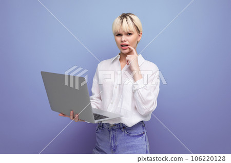 young successful blond student woman dressed in white blouse studying using laptop. education 106220128